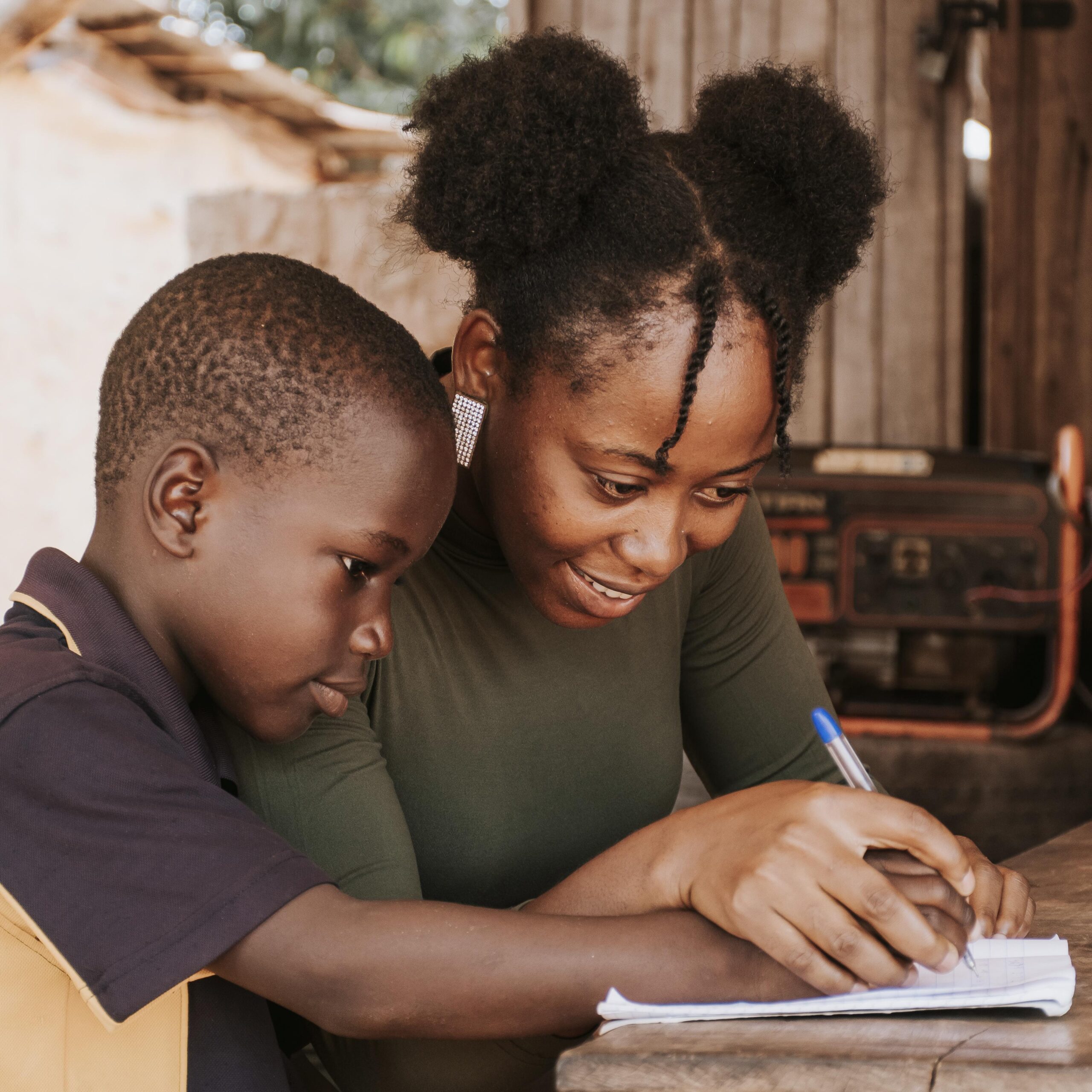 medium-shot-woman-teaching-kid-write